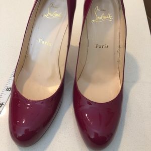 Christian Louboutin purple/magenta pumps!